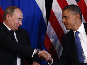 Putin and Obama shake hands. (Al Bawaba file photo)