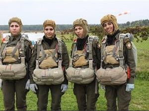 The Palestinian beauties (some looking happier than others) show off their paratrooper uniforms (Image courtesy of Maan News Agency)