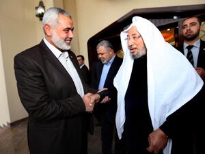  القرضاوي يحمل جوازاً فلسطينياً مزوراً