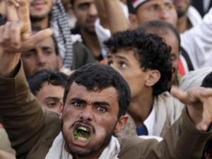 A Yemeni man chewing qat during a protest.