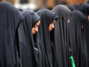 Iraqi Shiite Muslim women pray at the shrine of Imam Al Kadhim in the northern district of Kadhimiya, where the bomb exploded on Saturday. The bomb may have specifically targeted Shiites in the area. AFP Image
