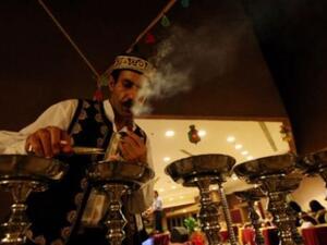 Preparing hookah for customers.