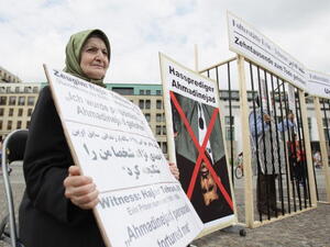 Witness Hajar Tehrani, Evin prison survivor (1981-1984), who was personally tortured by Iranian President Mahmoud Ahmadinejad, joins Iranian exiles protesting against stoning and condemns the forced concessions