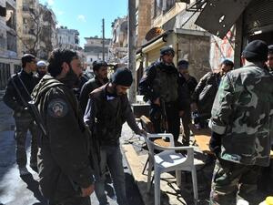 Syrian rebel fighters prepare to go into battle in Aleppo. (AFP PHOTO/BULENT KILIC)
