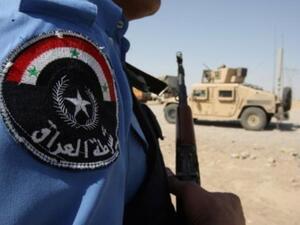 شرطي عراقي على حاجز قرب تكريت
