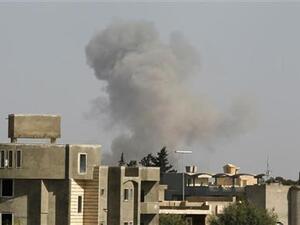 A plume of smoke is seen rising from the Libyan capital Tripoli earlier this year (file AFP)