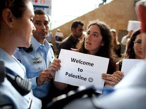 Left wing Israeli activists are arrested by Israeli police as they demonstrate in favor of the 'Welcome to Palestine' fly-in protest.