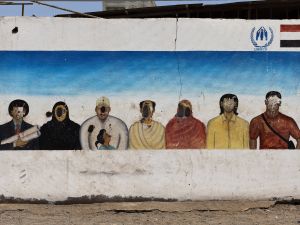 A damaged wall in a refugee camp in Yemen