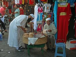 A man selling bread in front of a shop in Marrakesh. (Pixabay)