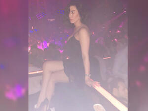 Nadine Al-Rassi posted a photo of herself in a nightclub wearing a very short dress. (Source: nadinealrassi - Instagram)