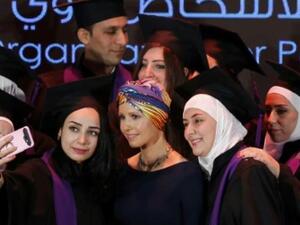 اسماء الاسد زوجة الرئيس السوري بشار الاسد خلال حفل تخرج لمدرسي أصحاب الاحتياجات الخاصة في دمشق

