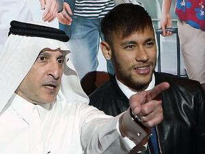 In this photo Neymar poses with the CEO of Qatar Airways Akbar Al-Baker. (AFP)