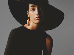 Nora Attal turned heads in a black gown and accessorized her look with chunky gold jewelry (Source: noraattal - Instagram)