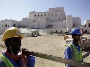 Foreign laborers working in road construction in Oman. (AFP)