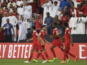  Oman and Turkmenistan looked set to be eliminated with a 1-1 draw, but two late goals sent the Gulf Cup champions through in the Asian Cup. 