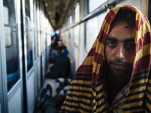 A Pakistani man travels on a train filled with other asylum-seekers bound for Belgrade, Serbia.  (AFP/Dimitar Dilkoff)