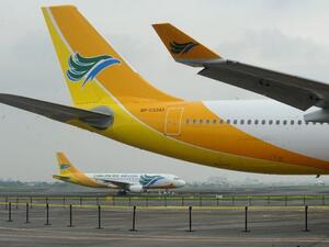 Filipino low-cost airline Cebu Pacific is suspending operations to and from Kuwait, Riyadh and Doha, claiming that these routes are no longer viable. (AFP/ Jay Directo)