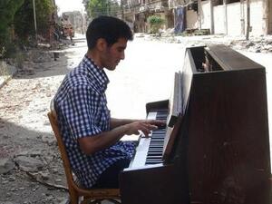 "The piano wasn't just an instrument. It was like the death of a friend," Aeham al-Ahmad told AFP. His piano burnt in front of him by Daesh fighters earlier this year, he has since then begun the long journey to a better life in Germany.  (AFP/File)