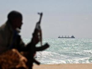 A pirate sits on the shore of a Nigerian beach, watching a ship. (AFP/Mohamed Dahir) A pirate sits on the shore of a Nigerian beach, watching a ship. (AFP/Mohamed Dahir)