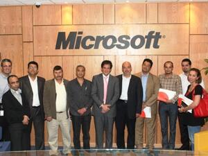 Microsoft Jordan team members group around Husni Khuffash