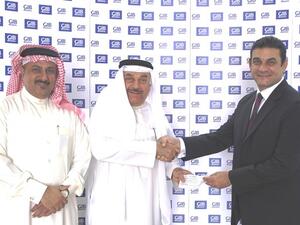 Ahmed A. Al-Ali, Treasurer of the Bahrain Down Syndrome Society, Jehad Al Zain, Deputy Chairman of the Bahrain Down Syndrome Society and Nader Shaheen, GIB Head of Corporate Communications 