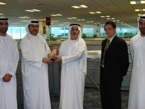Saeed Mohammed Ahmad, Senior Vice President, Procurement & Logistics Airline Services at Emirates Airlines receives honorary trophy from Abdulrahman Qassim Al Ali, Commercial Sales Manager at Emarat