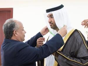 His Excellency Moulaye Ould Mohamed Laghdaf, prime minister of Mauritania, presenting His Excellency Dr. Sultan Ahmed Al Jaber, CEO of Masdar, with Mauritania’s Order of National Merit Medal