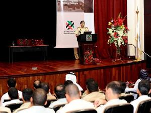 ADU students listening to a speech given during their visit