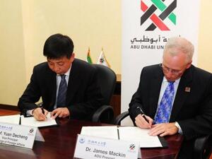 Professor Yuan Decheng, Vice Principal in charge of Foreign Affairs, Shenyang University of Chemical Technology and Dr. James Macking, Provost, Abu Dhabi University, signing the MoU