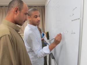 Ahmed Ali leads a class