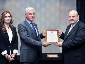 Tom Nauwelaerts, Managing Director of Al-Futtaim Logistics receiving the certificate