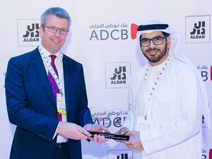 Talal Al Dhiyebi, Chief Development Officer at Aldar Properties and Colin Fraser, Group Head of Wholesale Banking at Abu Dhabi Commercial Bank, sign the ESCROW Agreement during Cityscape Abu Dhabi