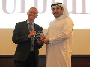 Ali Al Najjar, Assistant General Manager and Head of Operations Department at Al Ansari Exchange receiving the award at the Super Brands awarding ceremony.