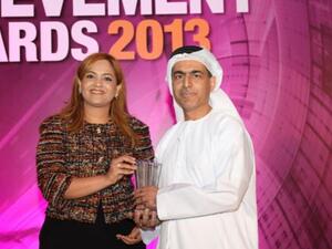 Ali Al Nuaimi, Chief Corporate Support Officer at Injazat Data Systems, receiving the Award