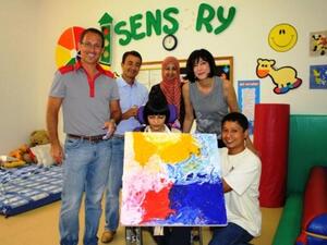 Children displaying their masterpieces at Cisco’s Giving Back Week 