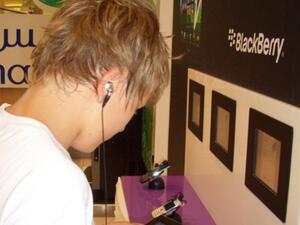 One customer testing the latest handsets and tablets at three Nawras Stores