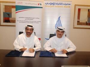 Khalid Al Kassim, Deputy Director General for Executive Affairs, DED with Mohammed Abdulla, CEO of SIB