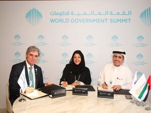 Reem Al Hashimy, Director General, Dubai Expo 2020 Bureau; Saeed Mohammed Al Tayer, MD & CEO of DEWA; and Joe Kaeser, President and CEO of Siemens, during the signing.