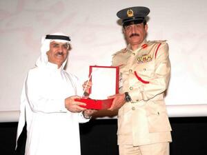 Major General Khamis Matar Al Mazina, deputy director of Dubai police honoring Hussain Kazim, Manager Corporate Communications at Emarat