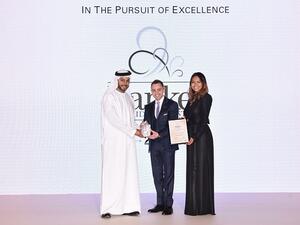 Dr. Adnan Chilwan, Group CEO at DIB receiving the award.