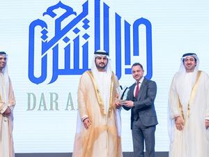 Dr. Adnan Chilwan, Group CEO at Dubai Islamic Bank, receives the award from HH Deputy Ruler of Dubai
