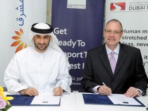 Abdul Baset, Chief Executive Officer of Dubai SME and Douglas Beckett, Head of Retail Banking Group at Mashreq during the signing