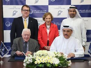 During the signing of the agreement between former U.S. President Jimmy Carter, founder of The Carter Center, and Mohamed Ali Al Ansari, Chairman of Al Ansari Exchange
