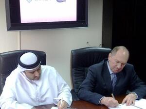Ahmed Obaid Al Mansoori, Director General of EIAST, and Dr. Vladimir Andreev, Director General of ISCK, signing the contract