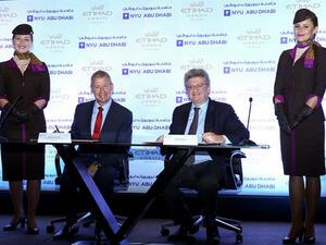 Ray Gammell, Etihad Airways’ Chief People and Performance Officer, and NYUAD Provost, Fabio Piano, celebrate the signing of the MoU between Etihad Airways and NYUAD.