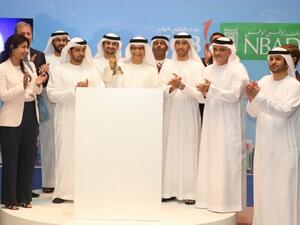 FGB and NBAD merger ceremony at Abu Dhabi Securities Exchange (ADX).