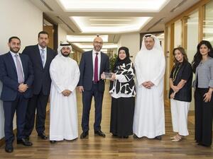 Mr. Khaled Al-Mutawa, General Manager – International Banking and Investments, and Mrs. Mona Mansour, General Manager –Customer Services Delivery accepting the award from Citibank representatives