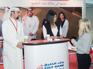 A member of the Gulf Bank team explaining the application process