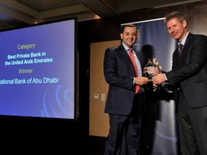 Hani AlNabulsi, Head of Business Development & Marketing in Private Banking at NBAD receives “Best Private Bank in UAE for 2013” award from Yuri Bender, Editor of Professional Wealth Management Magazine