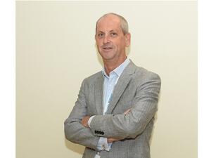 السيد إيان تولي، المدير التنفيذي لإدارة خدمات الصحة النفسية بمؤسسة حمد الطبية المؤسسات والشركات